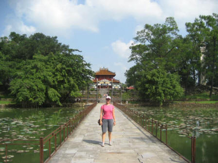 Carly on Bridge of Golden Waters in front of Thai Hoa Palace, Vietnam